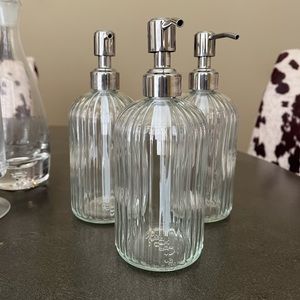 Decorative glass soap/lotion pump dispensers.